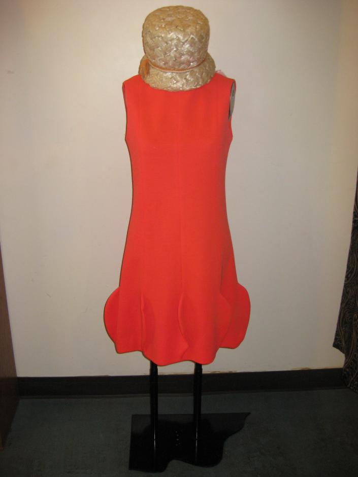 Hot orange fine wool shift dress,1960s by Youth Guild. The look is completed with a 1960s straw bucket hat by Dale Kelly.