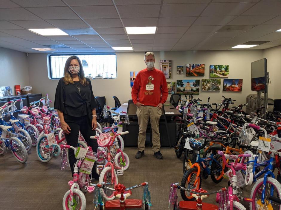 Rex & Beth with bikes being donated.