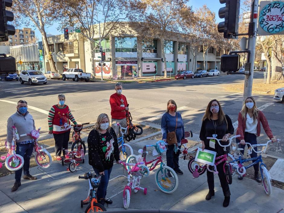 Group delivering bikes to WEAVE's office.