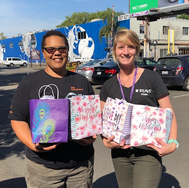 Dignity Health coworker and WEAVE coworker with Mother's Day bags
