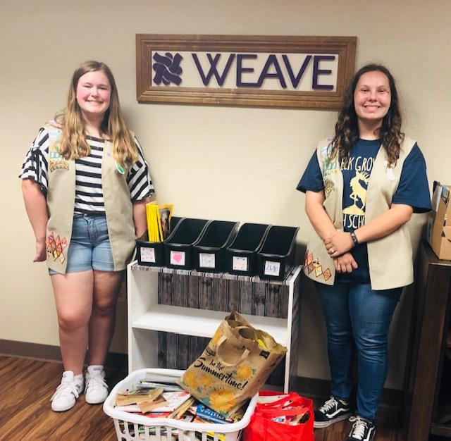 Girl Scout Troop 2690 and bookcase
