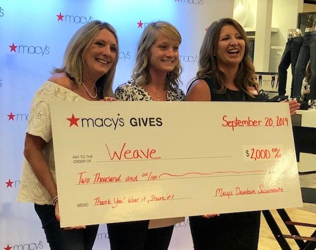 WEAVE team accepting check from Macy's 
