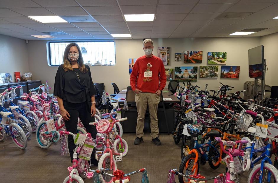 Rex & Beth with bikes being donated.