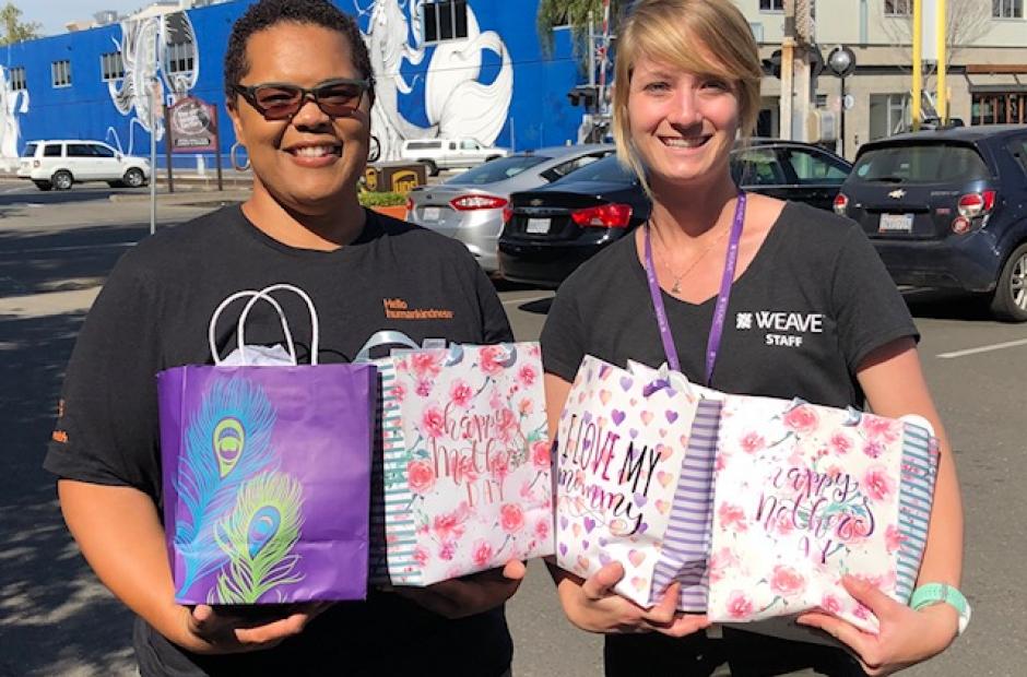 Dignity Health coworker and WEAVE coworker with Mother's Day bags